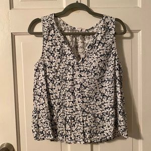 Women’s sleeveless, peplum top